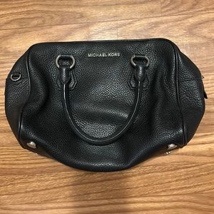 Michael Kors black leather handbag with silver accessories. About 8”x13”